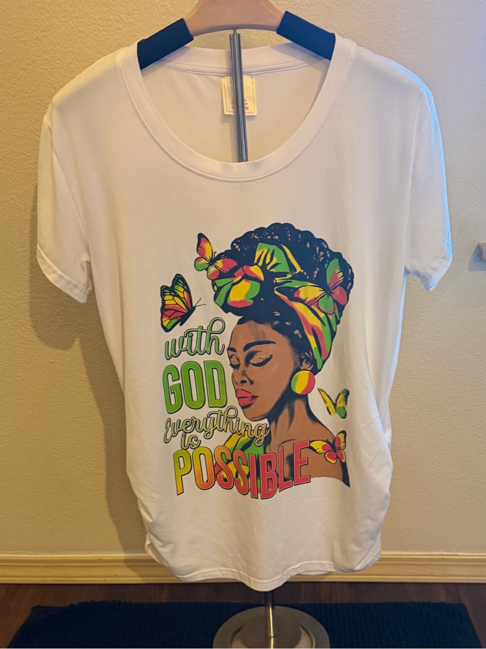 White Short-Sleeve Graphic Tee with Colorful Headwrap and Inspirational Text